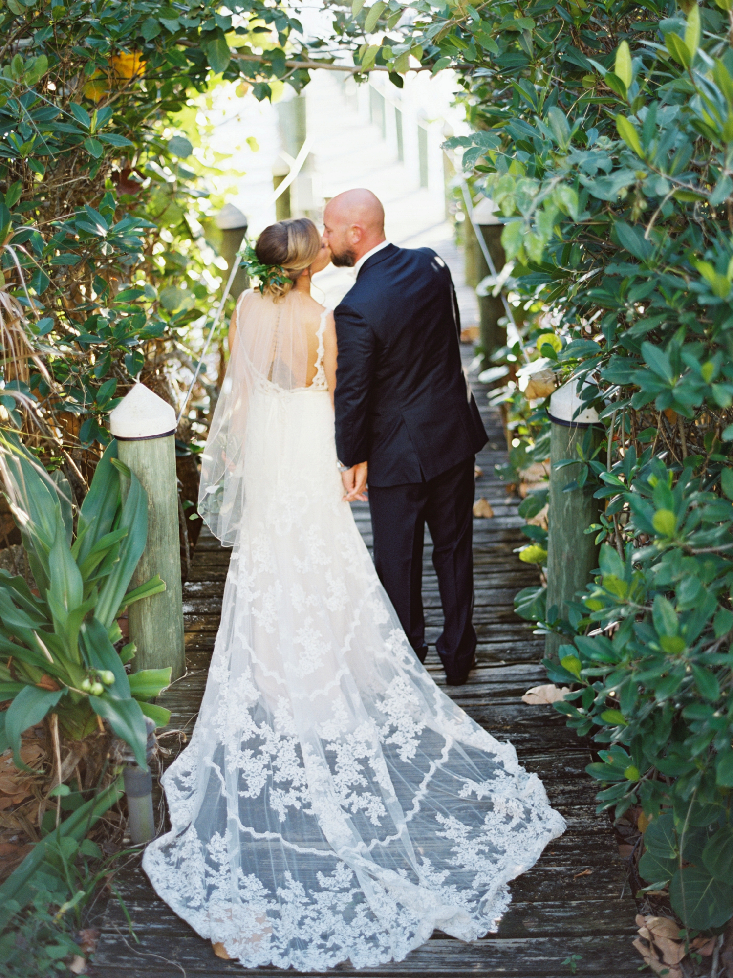 stella york wedding gown, white rose and greenery bouquet, lace wedding gown, navy groom suit, groom outfit ideas